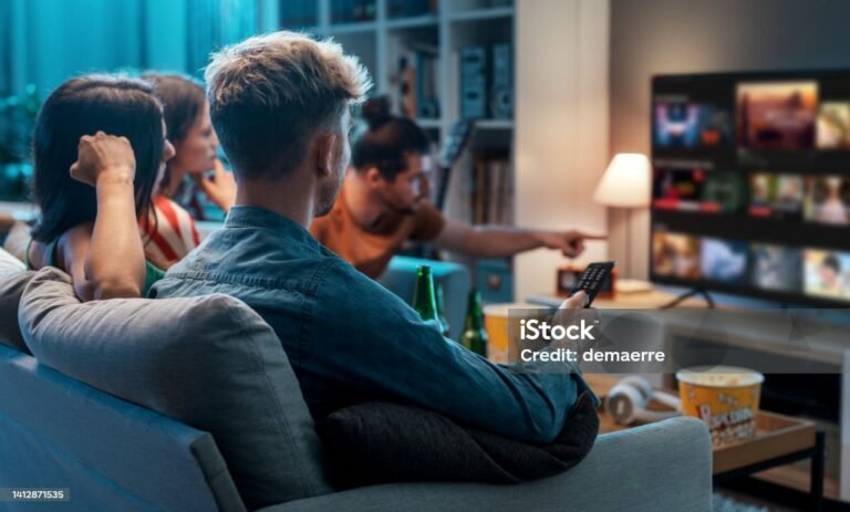 Friends choosing a movie to watch together at home, video on demand concept